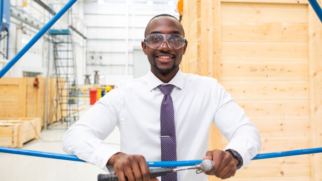 Smiling male employee at Hayward Tyler facility in Luton, United Kingdom