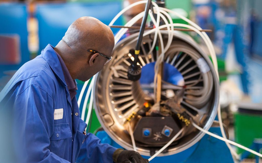 Technician at Hayward Tyler working on a fluid-filled pump in Luton, England